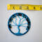 Blue Tree of Life suncatcher with crackle glass beads, wire branches, and a yarn-wrapped hoop displayed with tape measure to show size